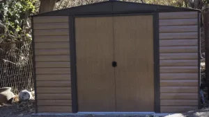 Will installing wood doors make my metal shed rust
